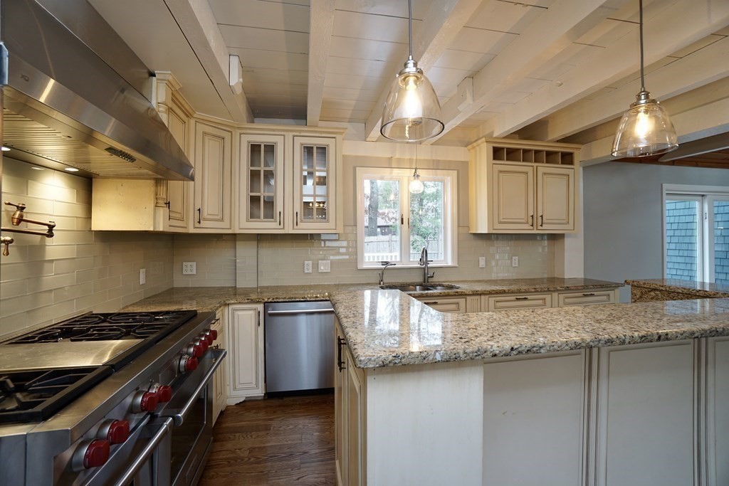 44 Avalon Circle Barnstable, MA 02655 - Photo 2 of 42 a kitchen with stainless steel appliances granite countertop a sink a stove and a wooden cabinets