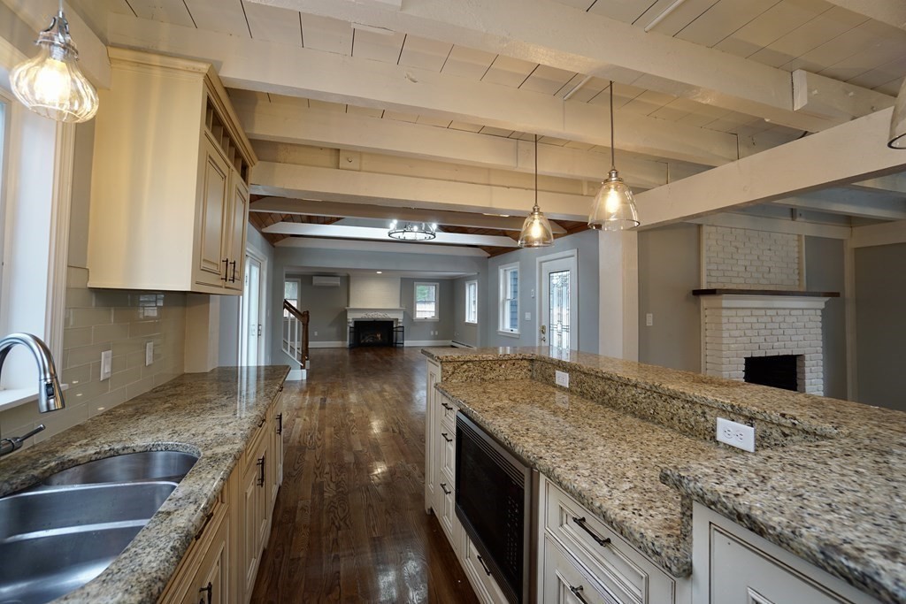 44 Avalon Circle Barnstable, MA 02655 - Photo 23 of 42 a kitchen with granite countertop a sink and a stove