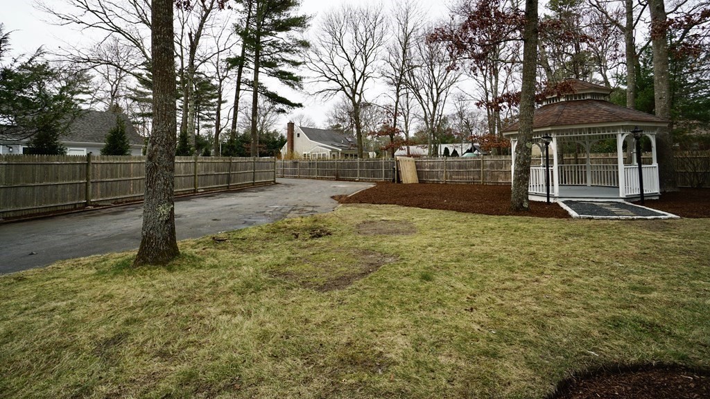 44 Avalon Circle Barnstable, MA 02655 - Photo 33 of 42 a view of a yard with plants and trees