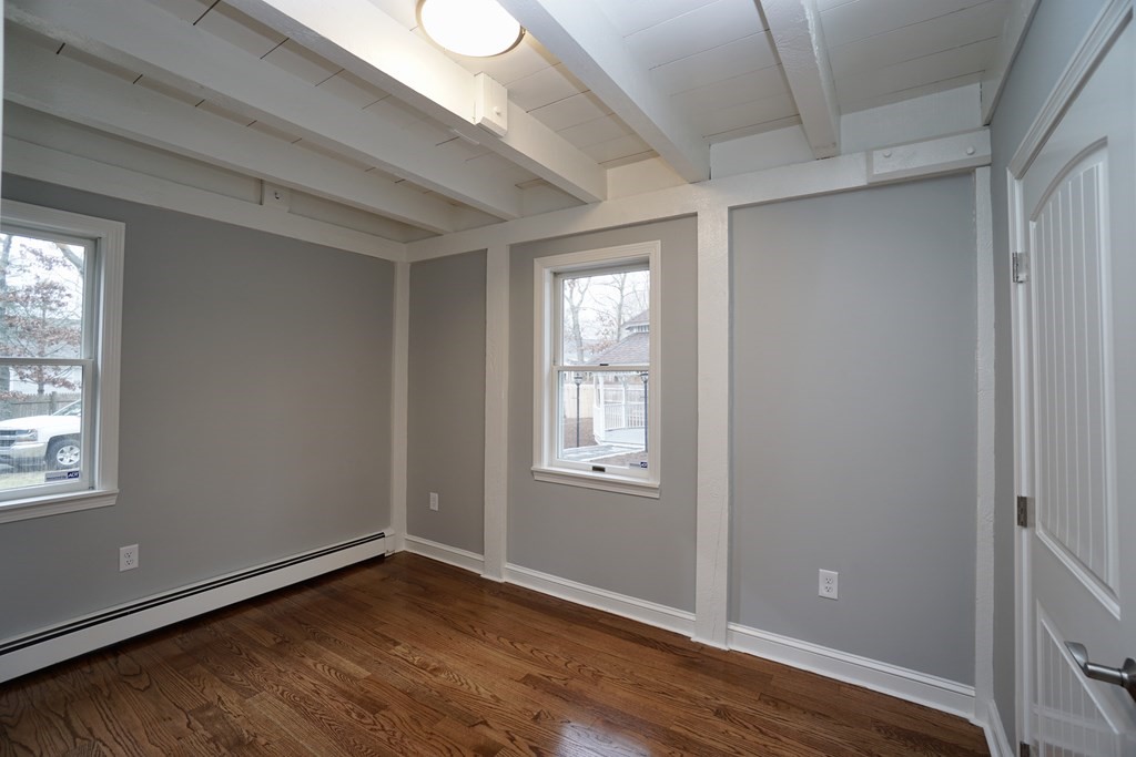 44 Avalon Circle Barnstable, MA 02655 - Photo 39 of 42 a view of an empty room with wooden floor and a window