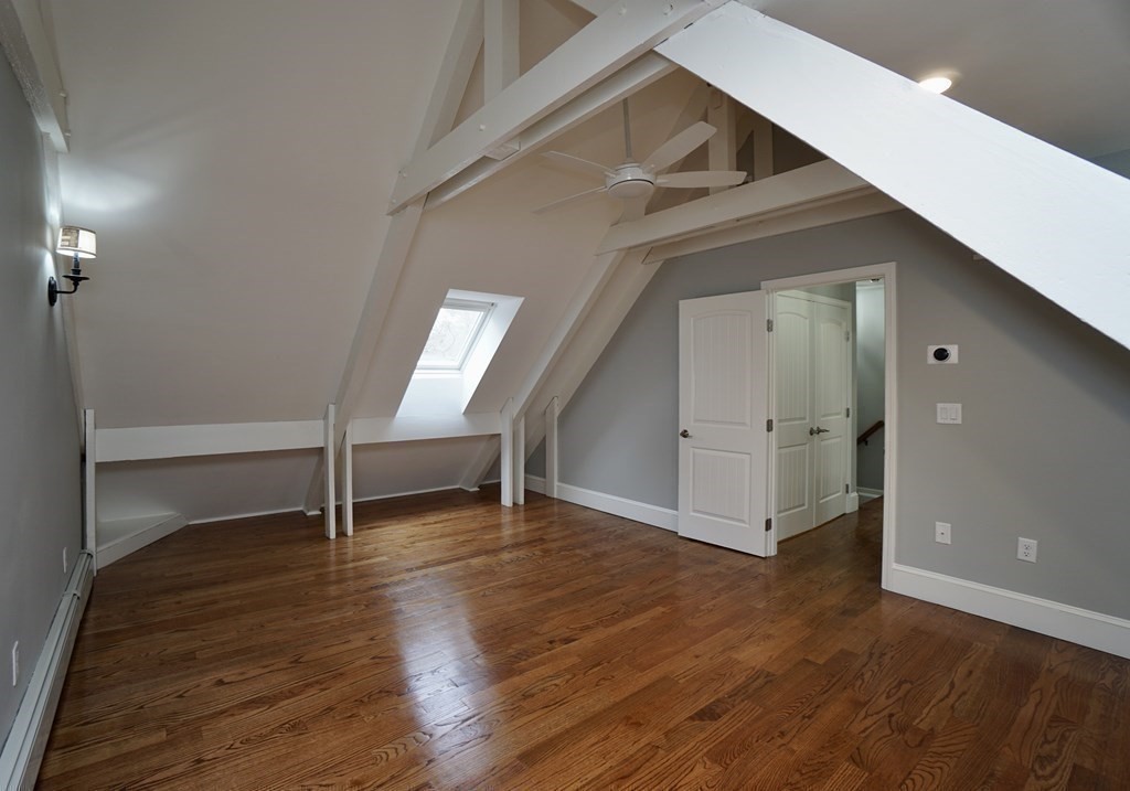 44 Avalon Circle Barnstable, MA 02655 - Photo 6 of 42 a view of an empty room with wooden floor and a window