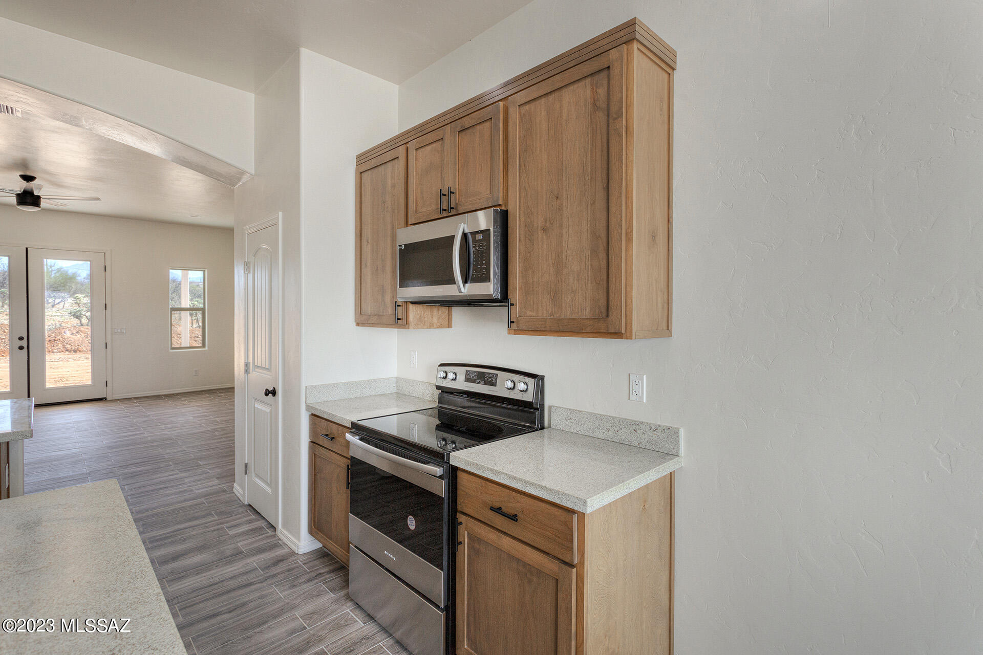 1813 Cajeme Court Rio Rico, AZ 85648 - Photo 8 of 15 a kitchen with a stove microwave and sink