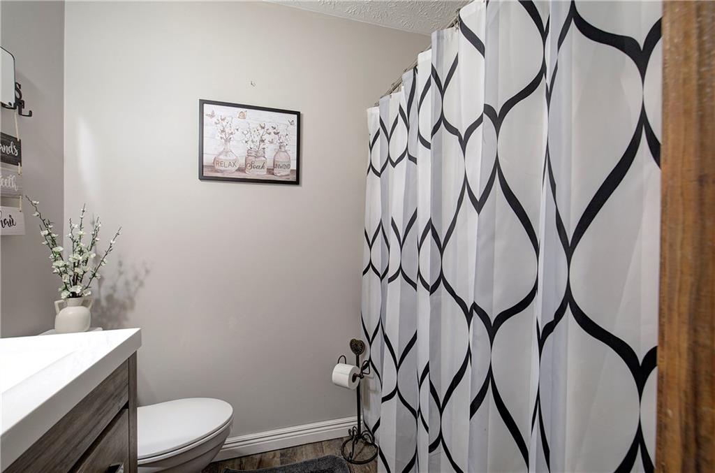 3637 Nebo Road Hiram, GA 30141 - Photo 38 of 63 a bathroom with a toilet sink and mirror
