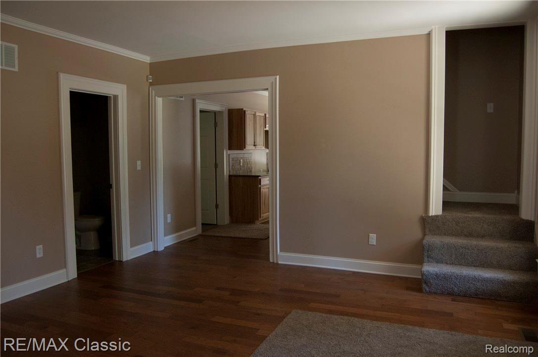 2038 Covert Road Burton, MI 48509 - Photo 20 of 25 EXPANSIVE HICKORY FLOORS FROM OFFICE TO FAMILY ROOM TO KITCHEN AND DINING ROOM