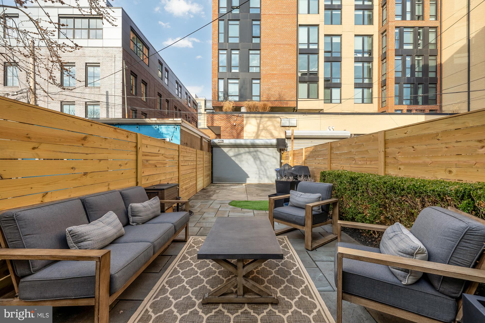 1834 6th Street Northwest Washington, DC 20001 - Photo 15 of 36 a view of a patio with couches chairs and wooden floor