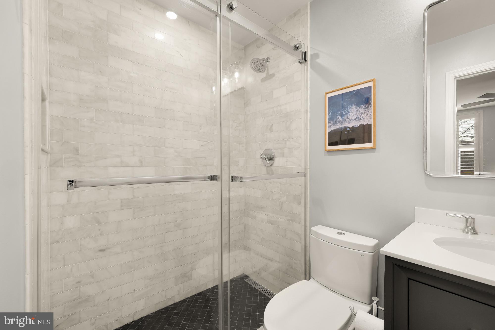 1834 6th Street Northwest Washington, DC 20001 - Photo 26 of 36 a bathroom with a toilet sink vanity and shower