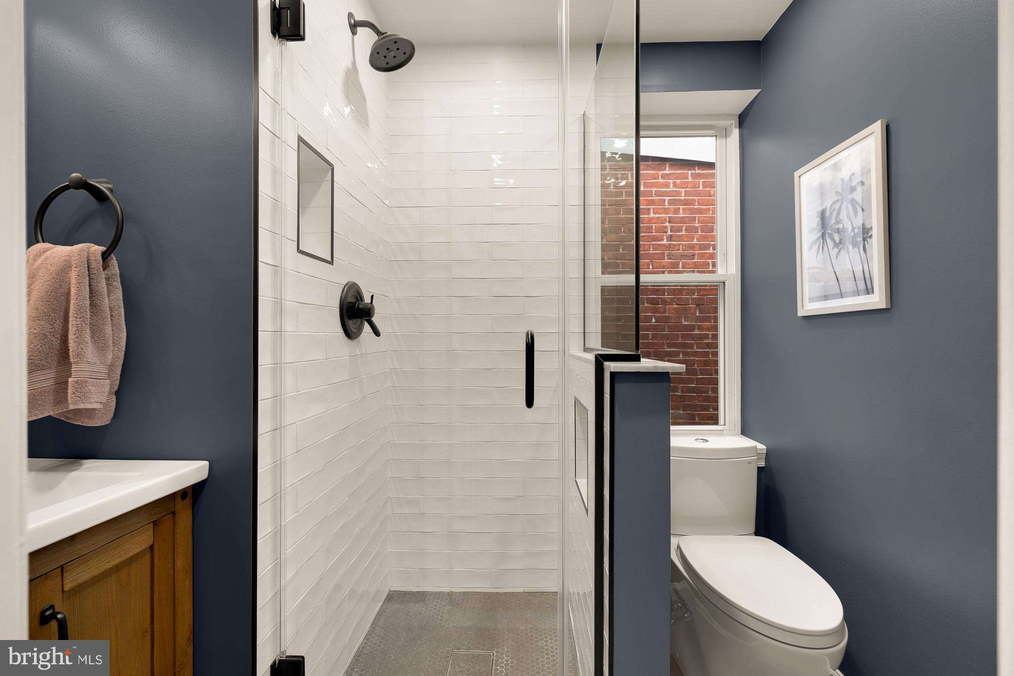 1834 6th Street Northwest Washington, DC 20001 - Photo 29 of 36 a bathroom with a toilet a sink and shower