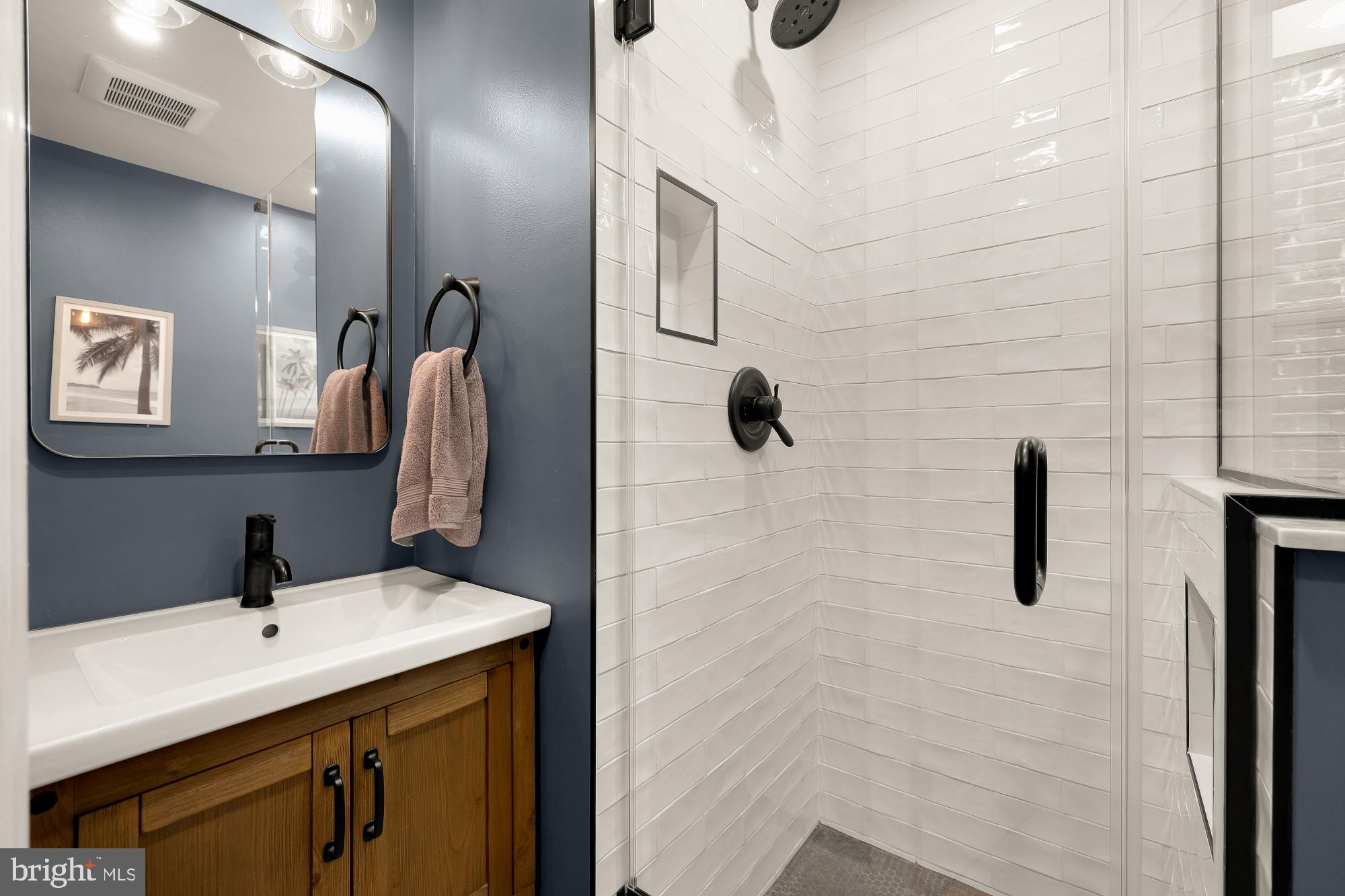 1834 6th Street Northwest Washington, DC 20001 - Photo 30 of 36 a bathroom with a sink and mirror