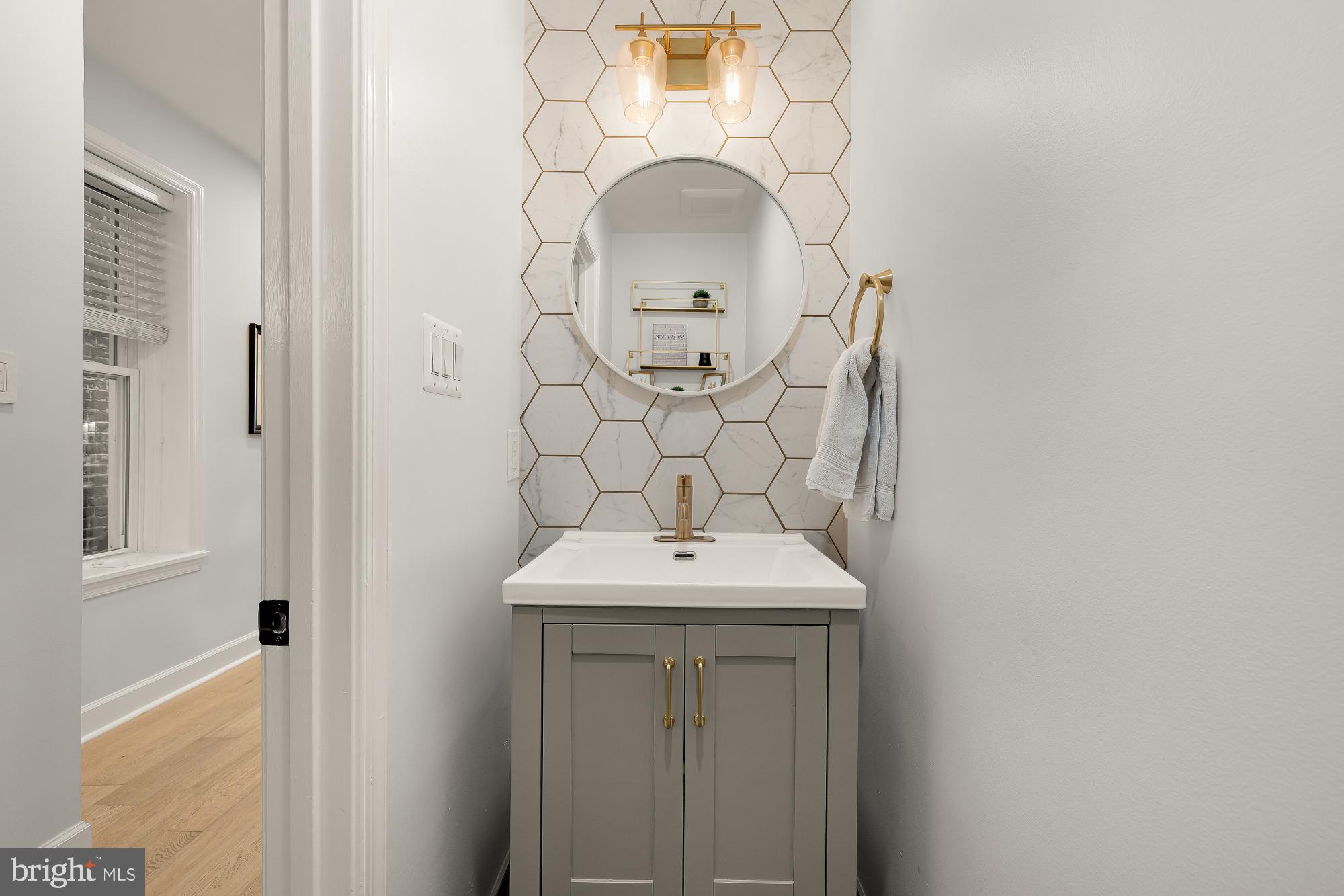 1834 6th Street Northwest Washington, DC 20001 - Photo 8 of 36 a bathroom with a sink and a mirror
