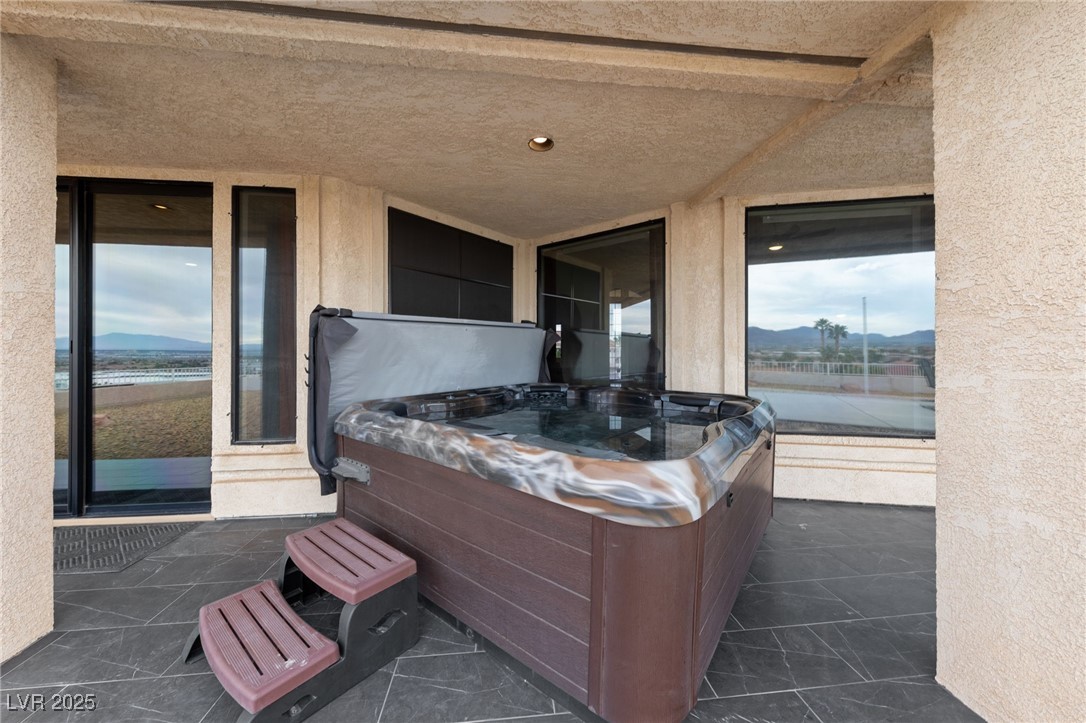 1056 Calico Ridge Drive Henderson, NV 89011 - Photo 22 of 67 View of patio / terrace featuring a hot tub