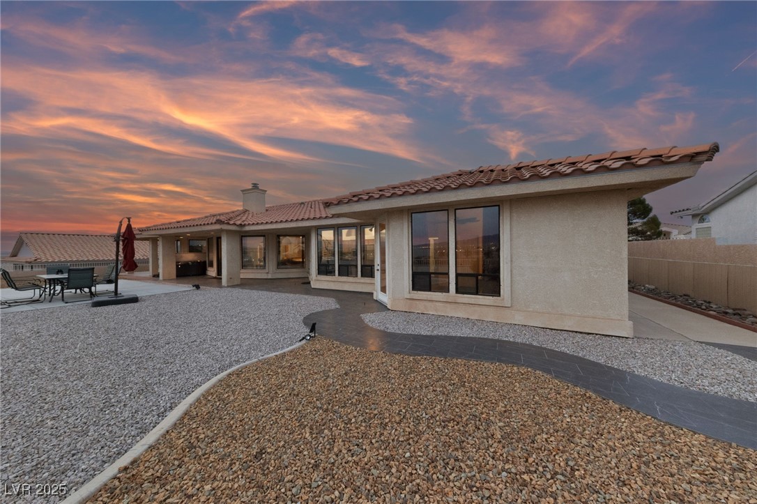 1056 Calico Ridge Drive Henderson, NV 89011 - Photo 44 of 67 Back of house featuring stucco siding, a patio area, fence, a tile roof, and a chimney