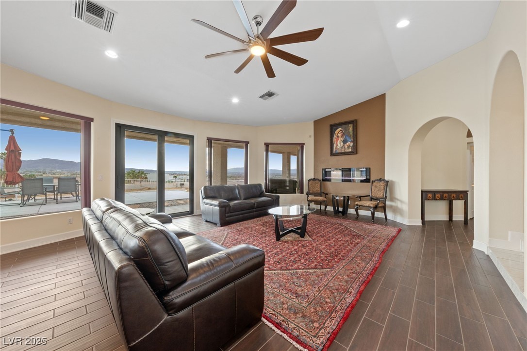 1056 Calico Ridge Drive Henderson, NV 89011 - Photo 6 of 67 Living room with dark wood-type flooring, visible vents, and ceiling fan