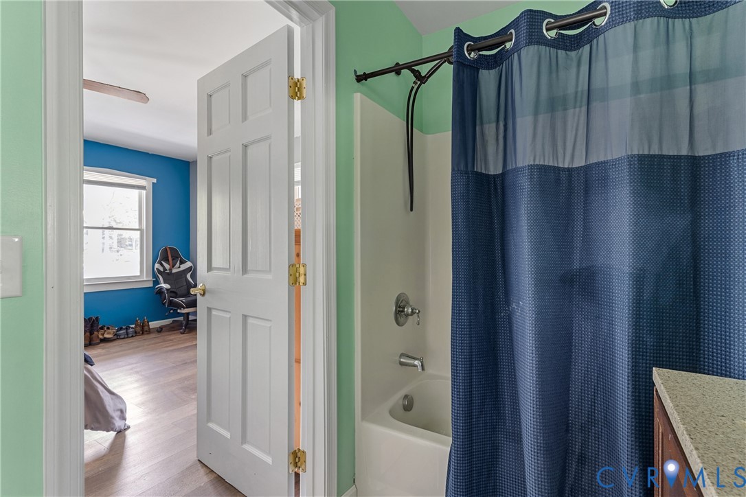 80 Mill Ridge Road Hartfield, VA 23071 - Photo 24 of 43 Bathroom featuring a white bathtub and shower with