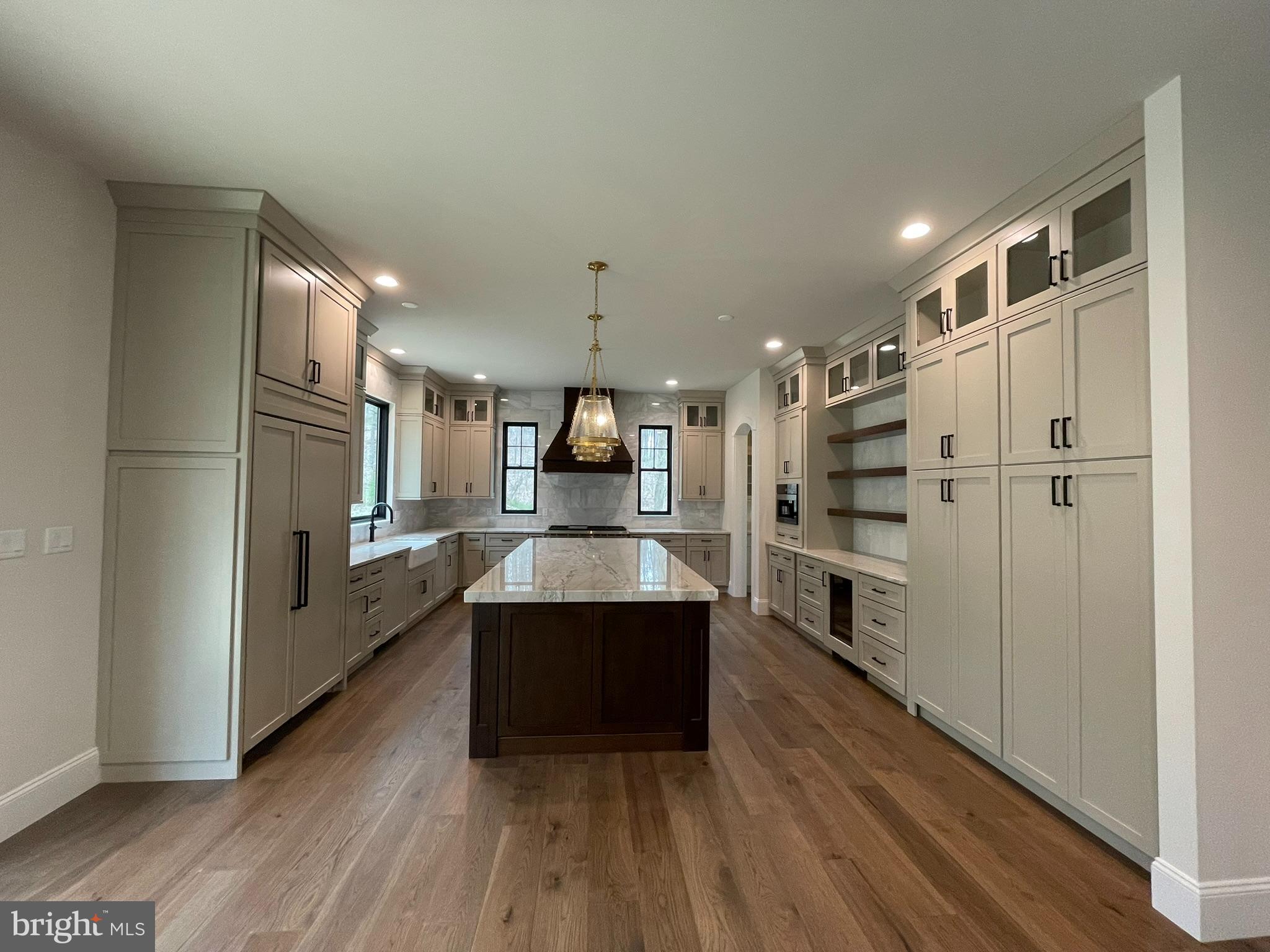 380 Zynn Road Downingtown, PA 19335 - Photo 13 of 53 a kitchen with stainless steel appliances a refrigerator and a wooden floors
