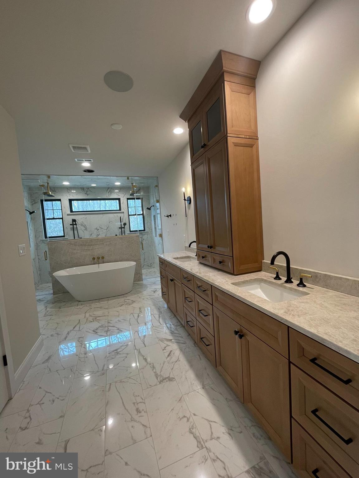 380 Zynn Road Downingtown, PA 19335 - Photo 22 of 53 a spacious bathroom with a granite countertop sink a toilet and a mirror