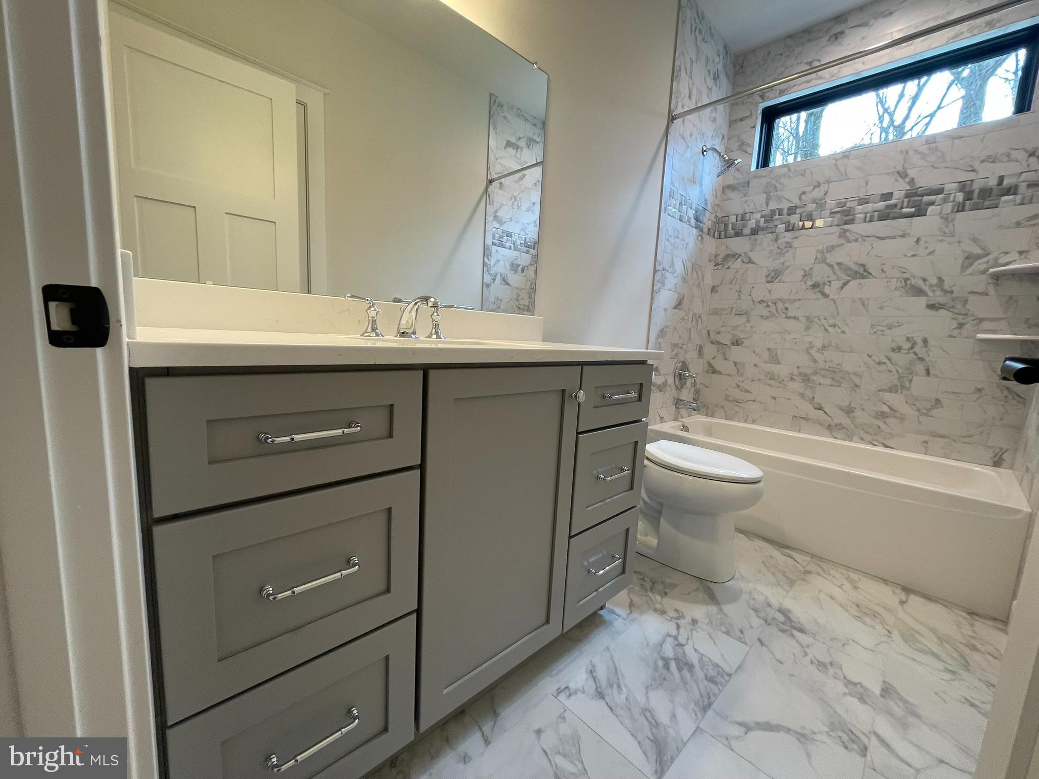 380 Zynn Road Downingtown, PA 19335 - Photo 27 of 53 a bathroom with a sink a toilet and bathtub