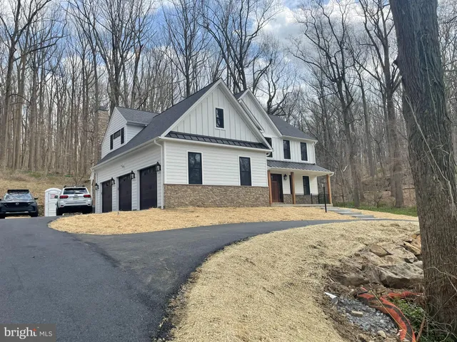 a front view of a house with a garage