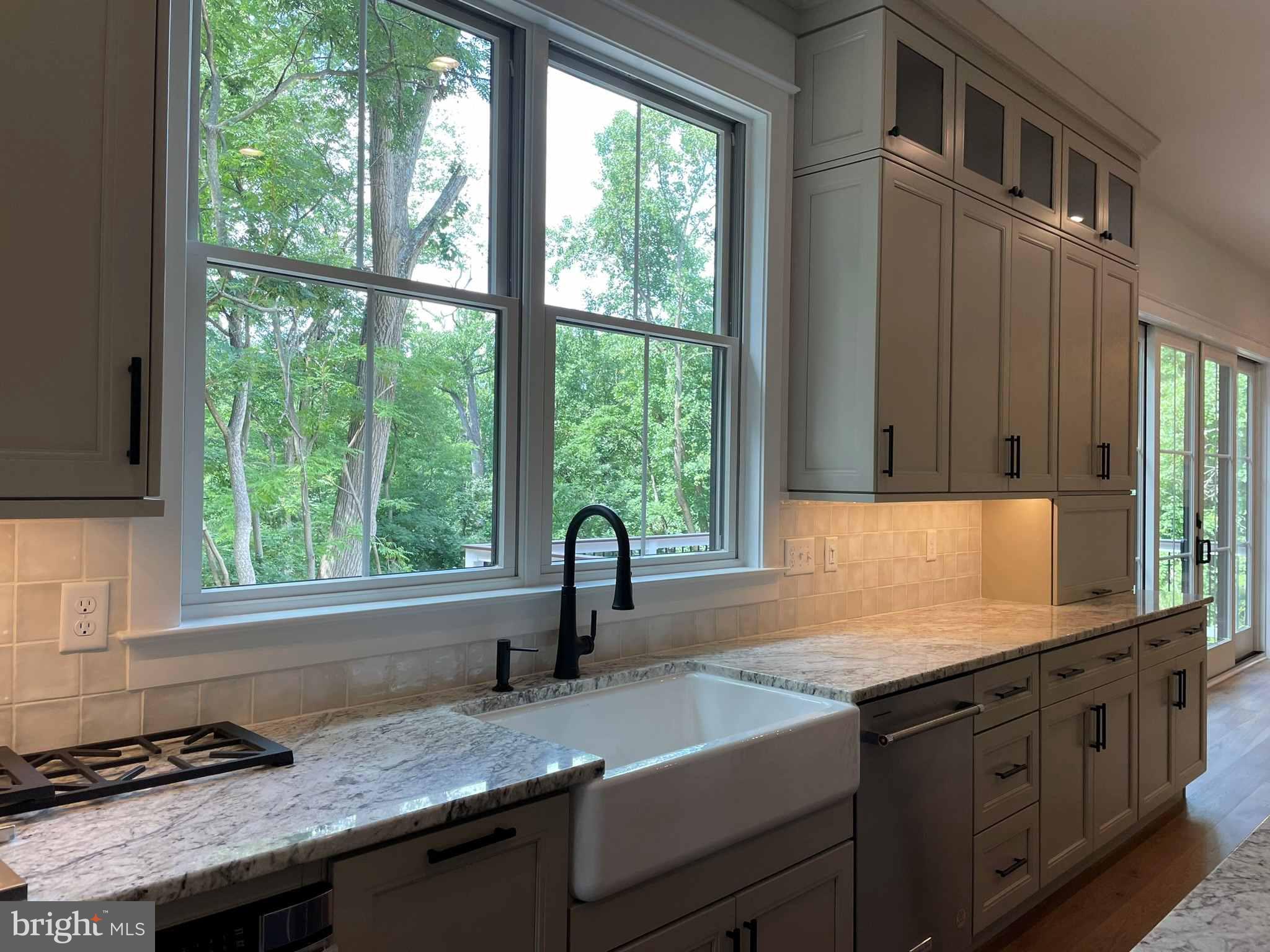 380 Zynn Road Downingtown, PA 19335 - Photo 36 of 53 a kitchen with granite countertop a sink and a window
