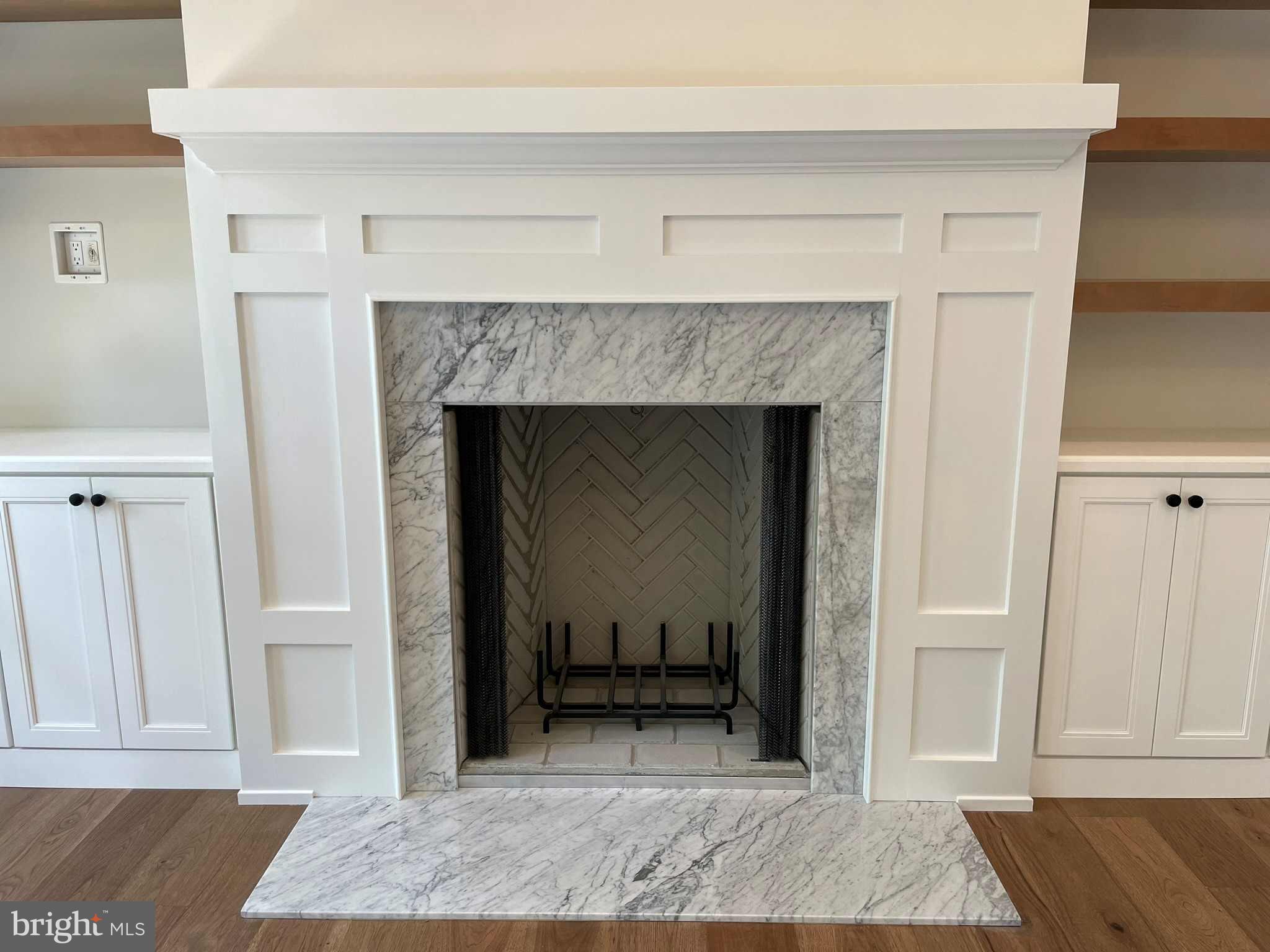380 Zynn Road Downingtown, PA 19335 - Photo 40 of 53 a view of a livingroom with a fireplace and cabinet