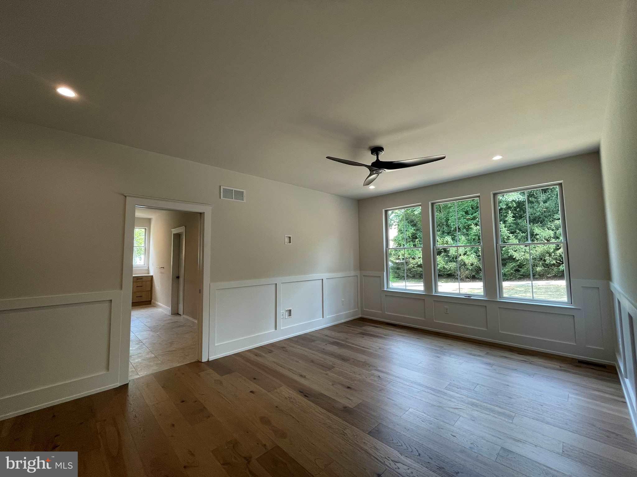 380 Zynn Road Downingtown, PA 19335 - Photo 47 of 53 an empty room with wooden floor and windows
