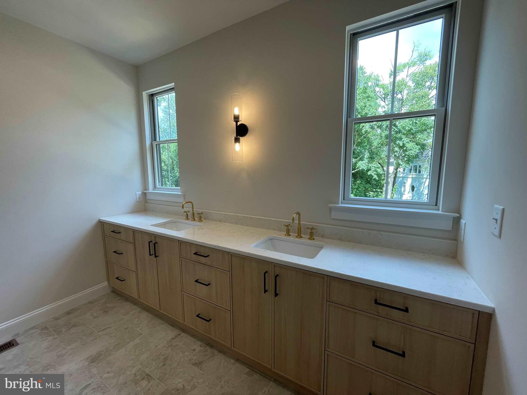 380 Zynn Road Downingtown, PA 19335 - Photo 48 of 53 a bathroom with a double vanity sink and a window