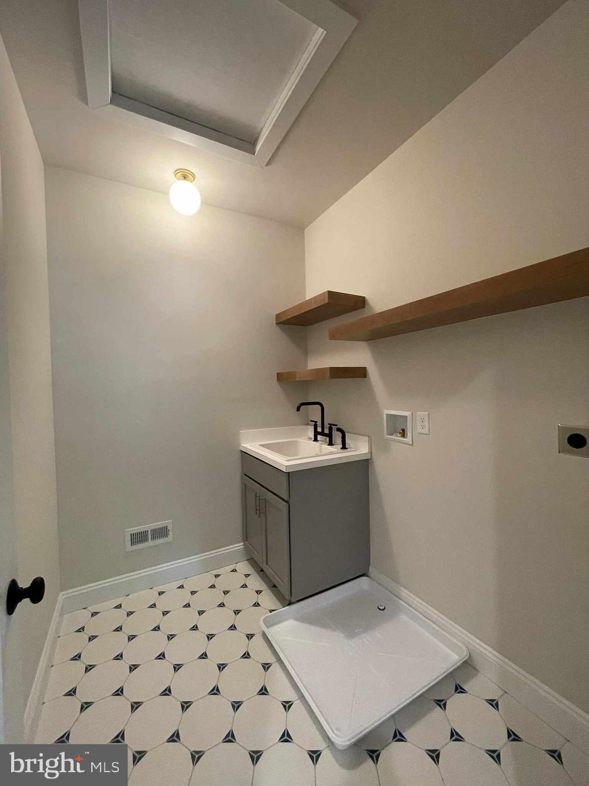 380 Zynn Road Downingtown, PA 19335 - Photo 51 of 53 a utility room with sink dryer and washer