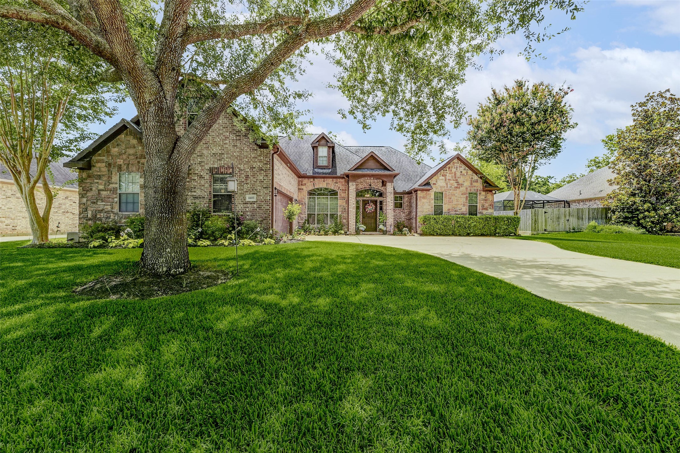4403 Wickby Street Fulshear, TX 77441 - Photo 1 of 50 a front view of house with yard and green space