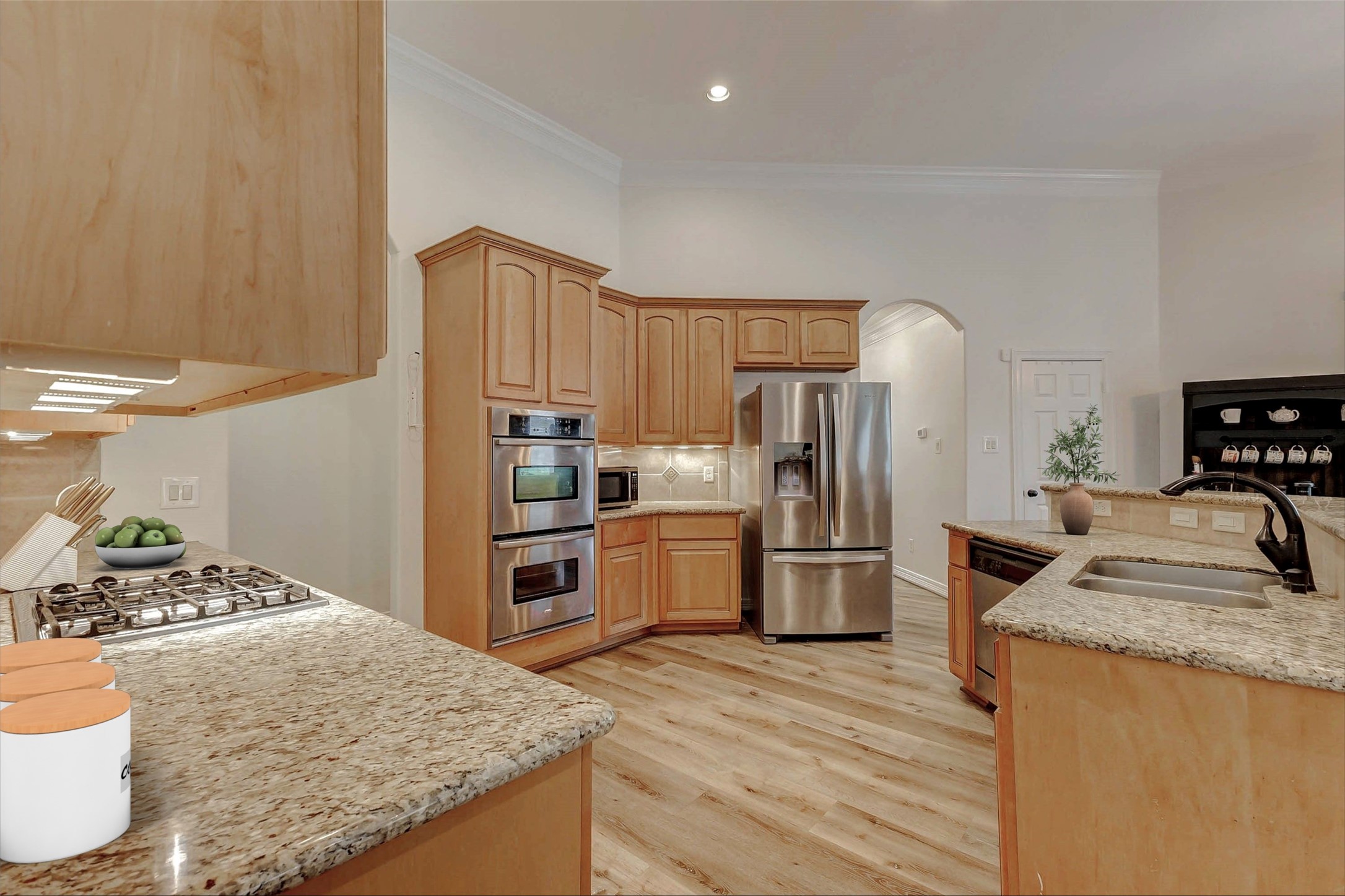 4403 Wickby Street Fulshear, TX 77441 - Photo 14 of 50 a kitchen with refrigerator a sink and wooden cabinets