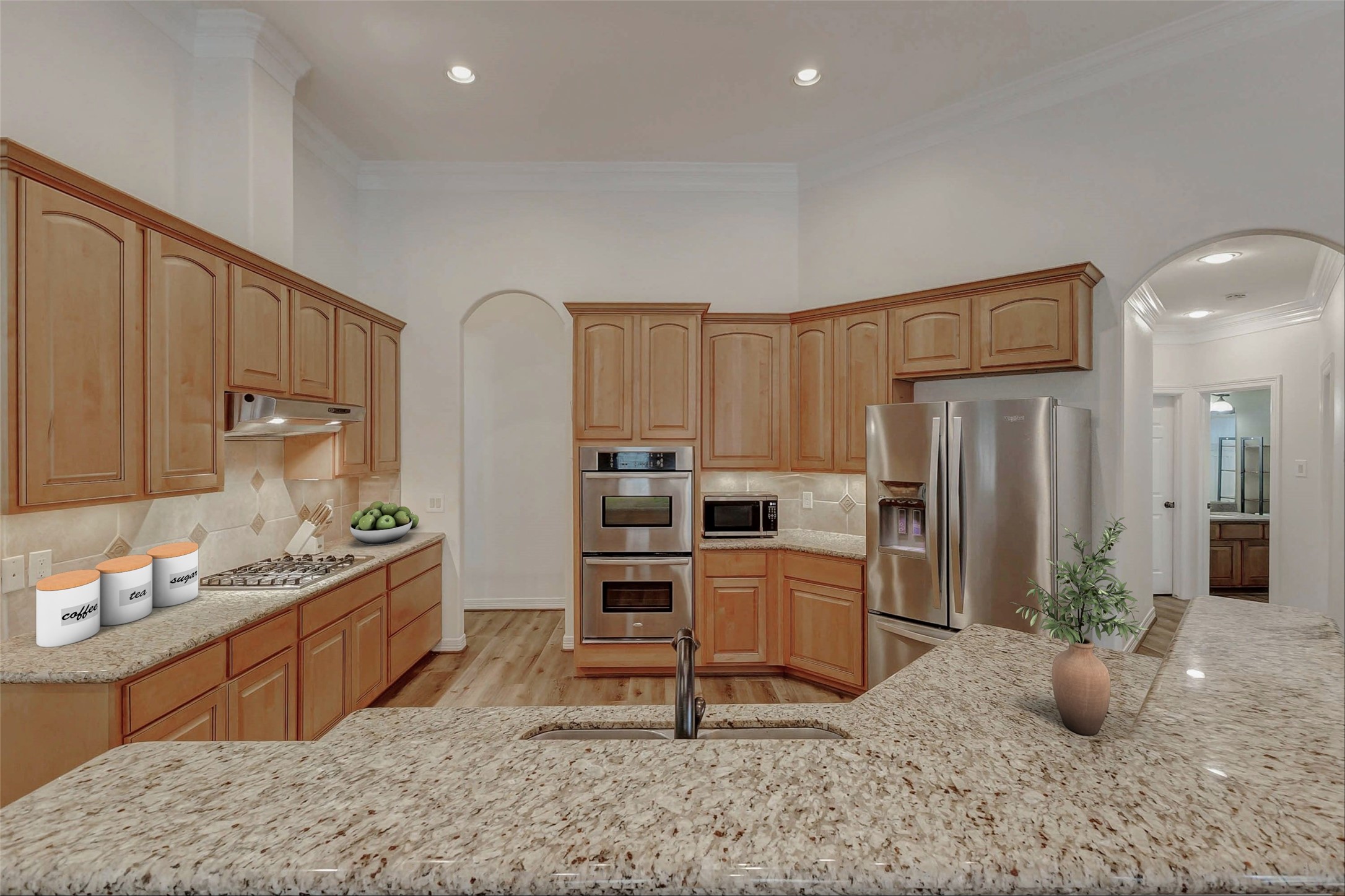 4403 Wickby Street Fulshear, TX 77441 - Photo 15 of 50 a kitchen with furniture a refrigerator and a sink