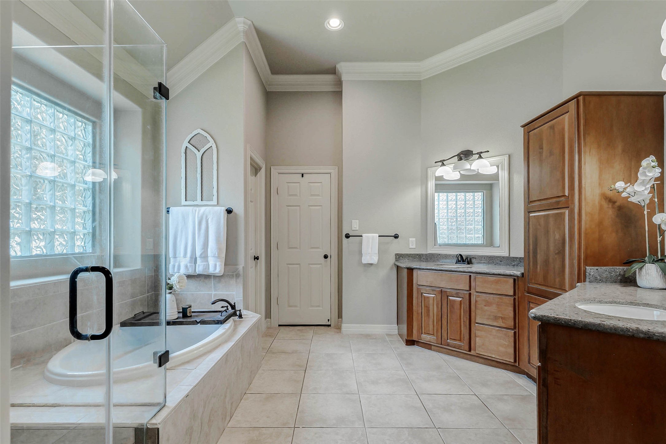 4403 Wickby Street Fulshear, TX 77441 - Photo 23 of 50 a bathroom with a bathtub sink and a mirror