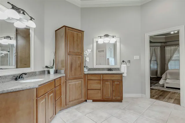 a spacious bathroom with a granite countertop sink and a mirror