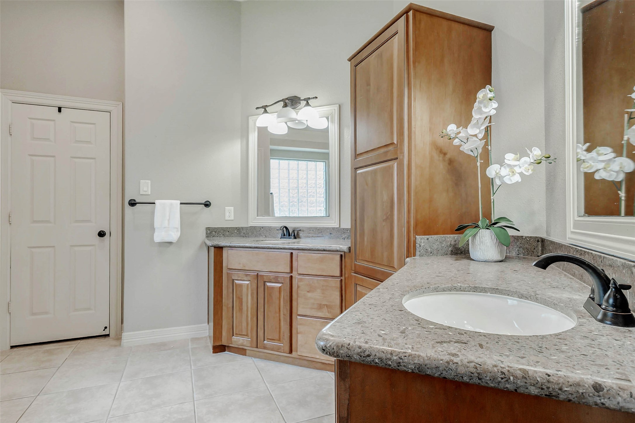 4403 Wickby Street Fulshear, TX 77441 - Photo 25 of 50 a bathroom with a granite countertop sink and a mirror