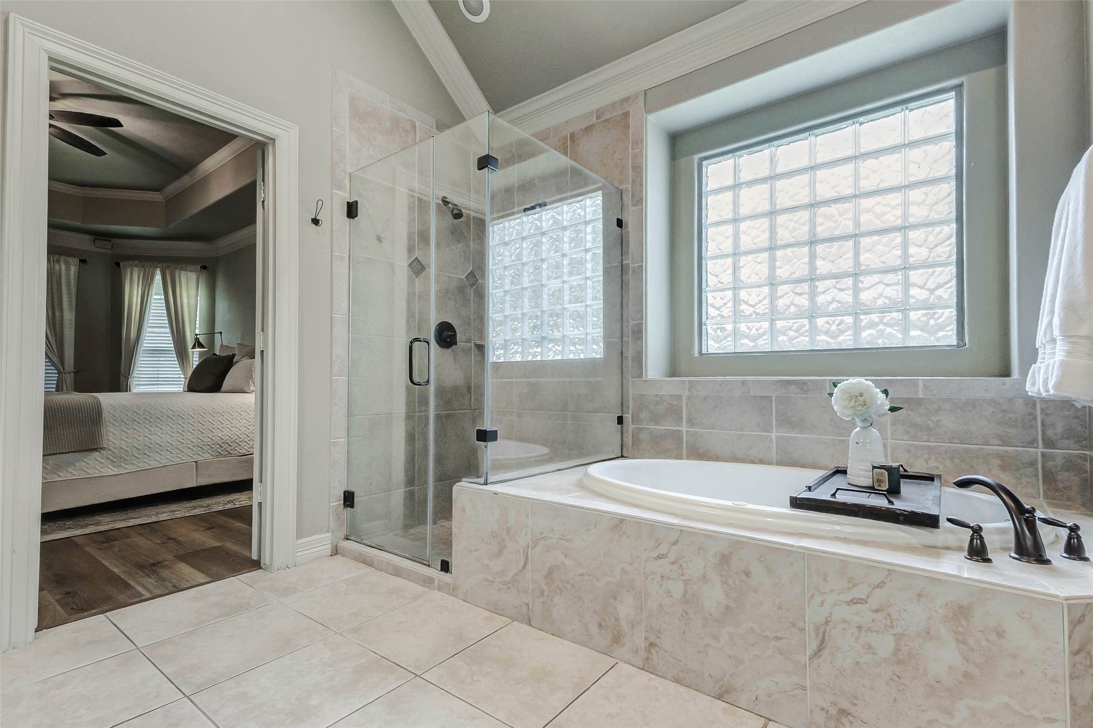4403 Wickby Street Fulshear, TX 77441 - Photo 27 of 50 a bathroom with a tub sink and mirror