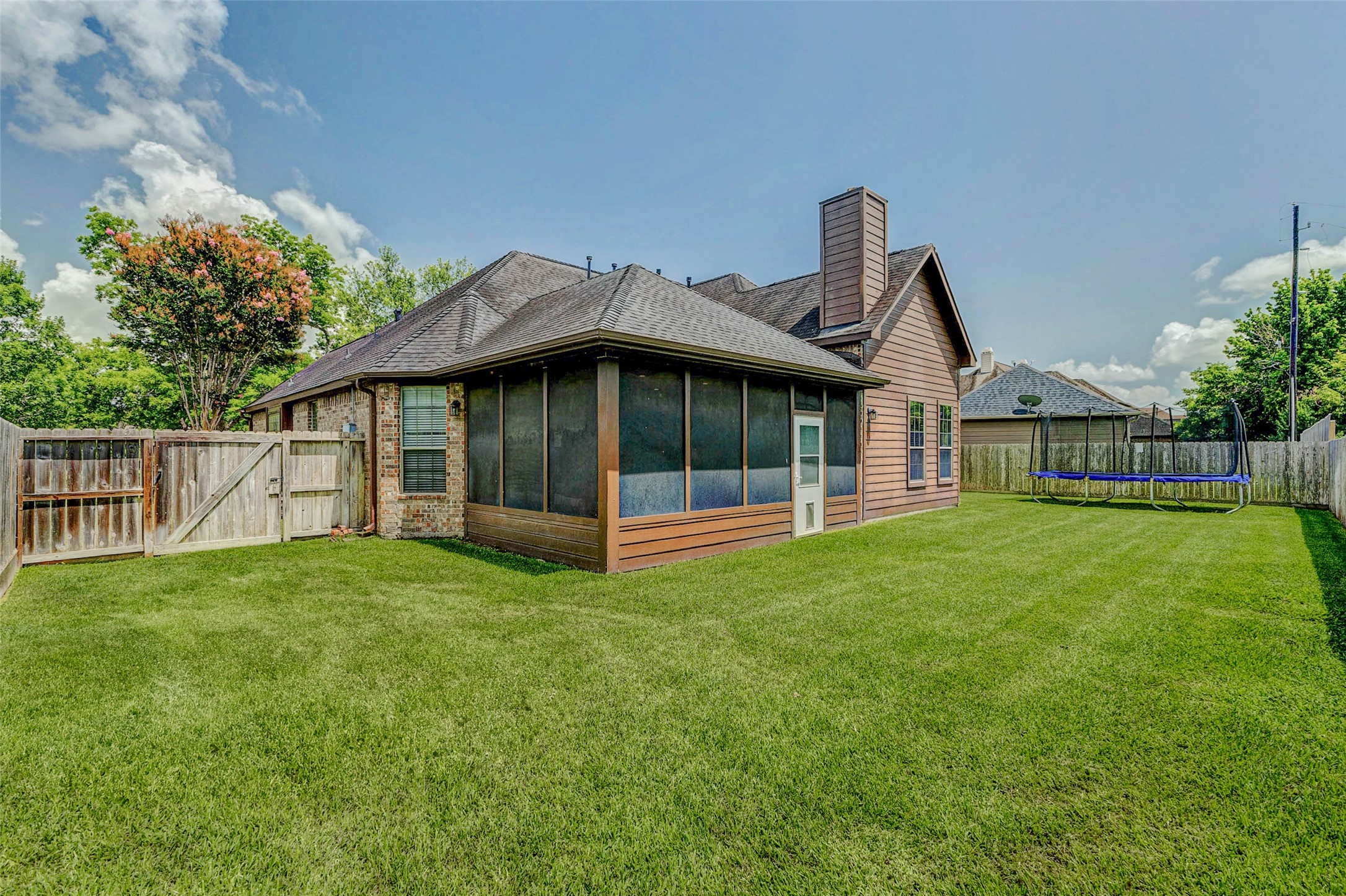 4403 Wickby Street Fulshear, TX 77441 - Photo 41 of 50 a view of a house with backyard and garden