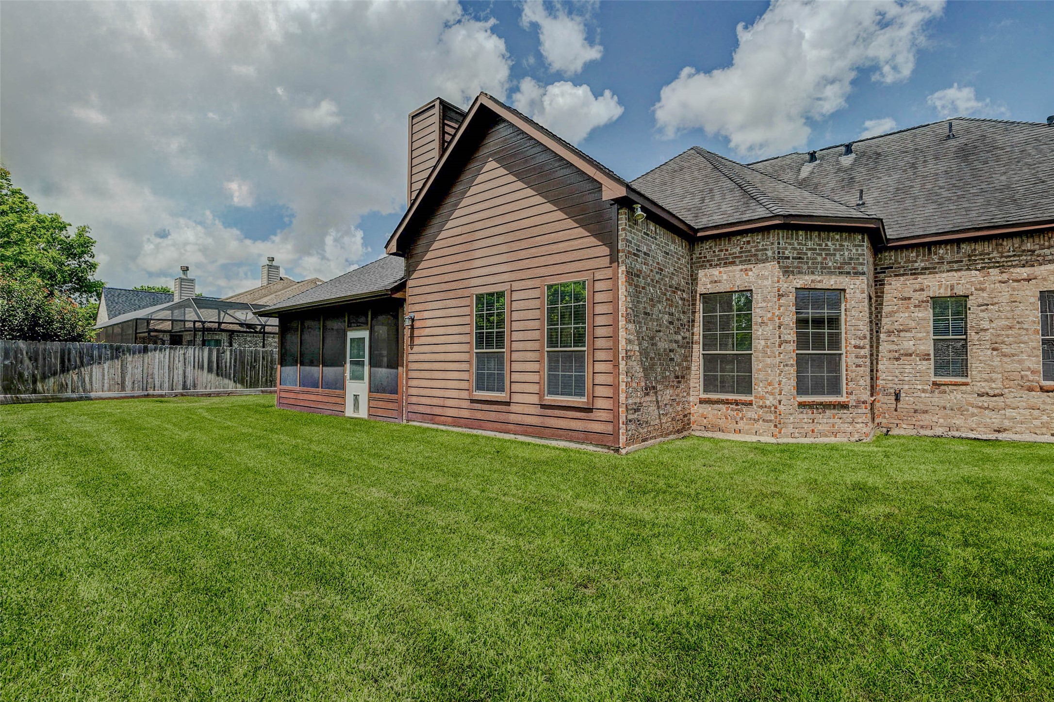4403 Wickby Street Fulshear, TX 77441 - Photo 42 of 50 a front view of a house with a garden