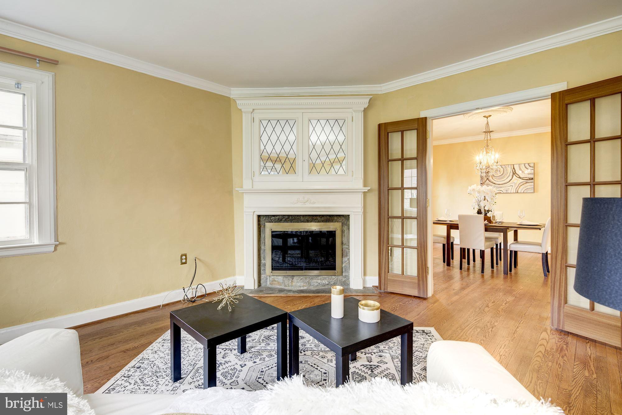716 Stoneleigh Road Baltimore, MD 21212 - Photo 14 of 44 Above the fireplace is a cabinet hiding tv
