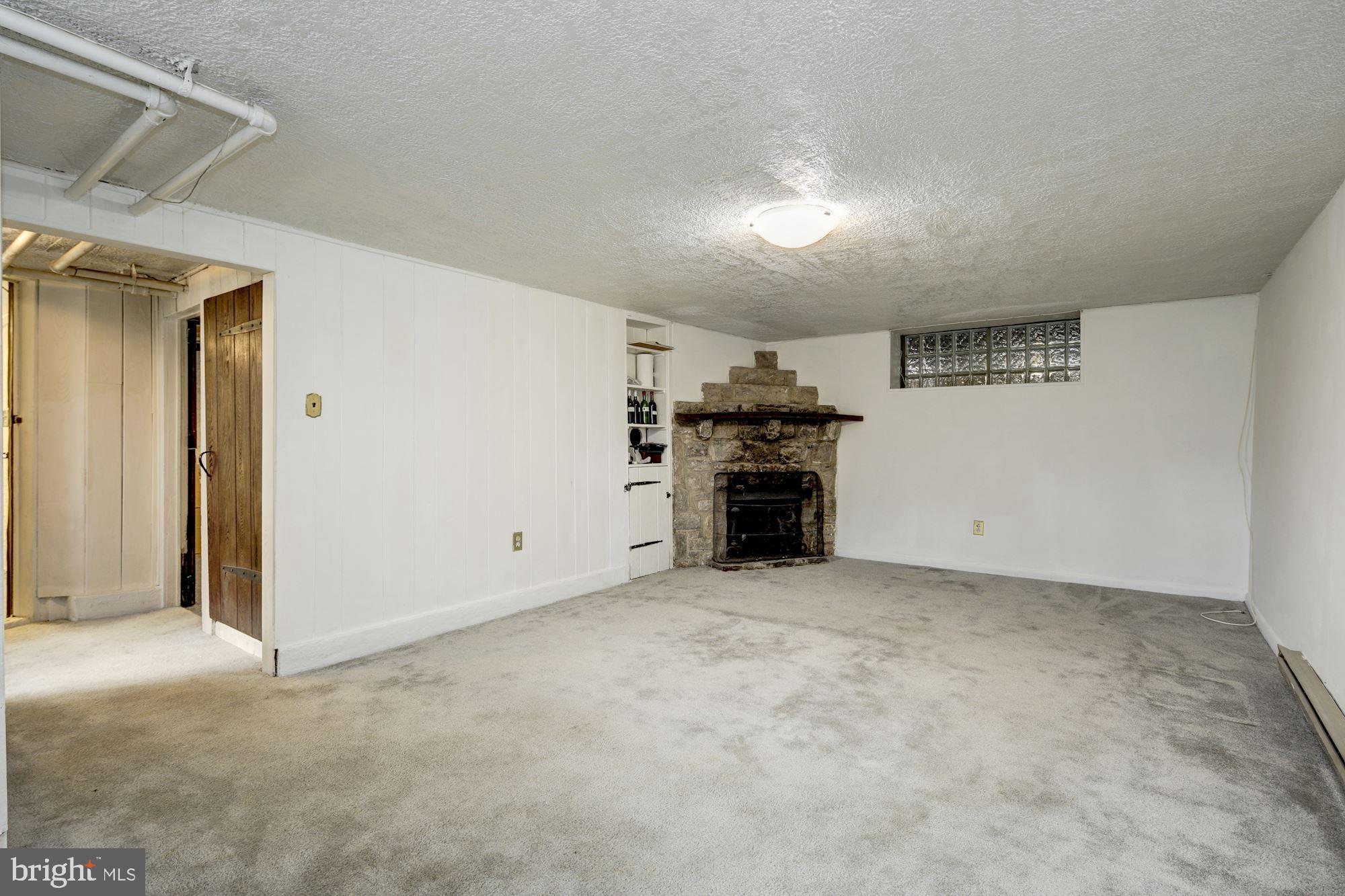 716 Stoneleigh Road Baltimore, MD 21212 - Photo 34 of 44 Finished lower level with new carpet.