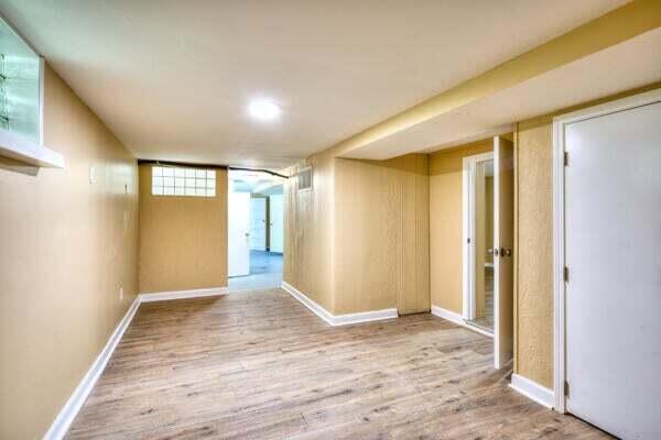 3701 Monroe Street Gary, IN 46408 - Photo 18 of 22 a view of an empty room with wooden floor and a window