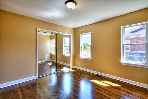 3701 Monroe Street Gary, IN 46408 - Photo 9 of 22 a view of empty room with wooden floor and fan