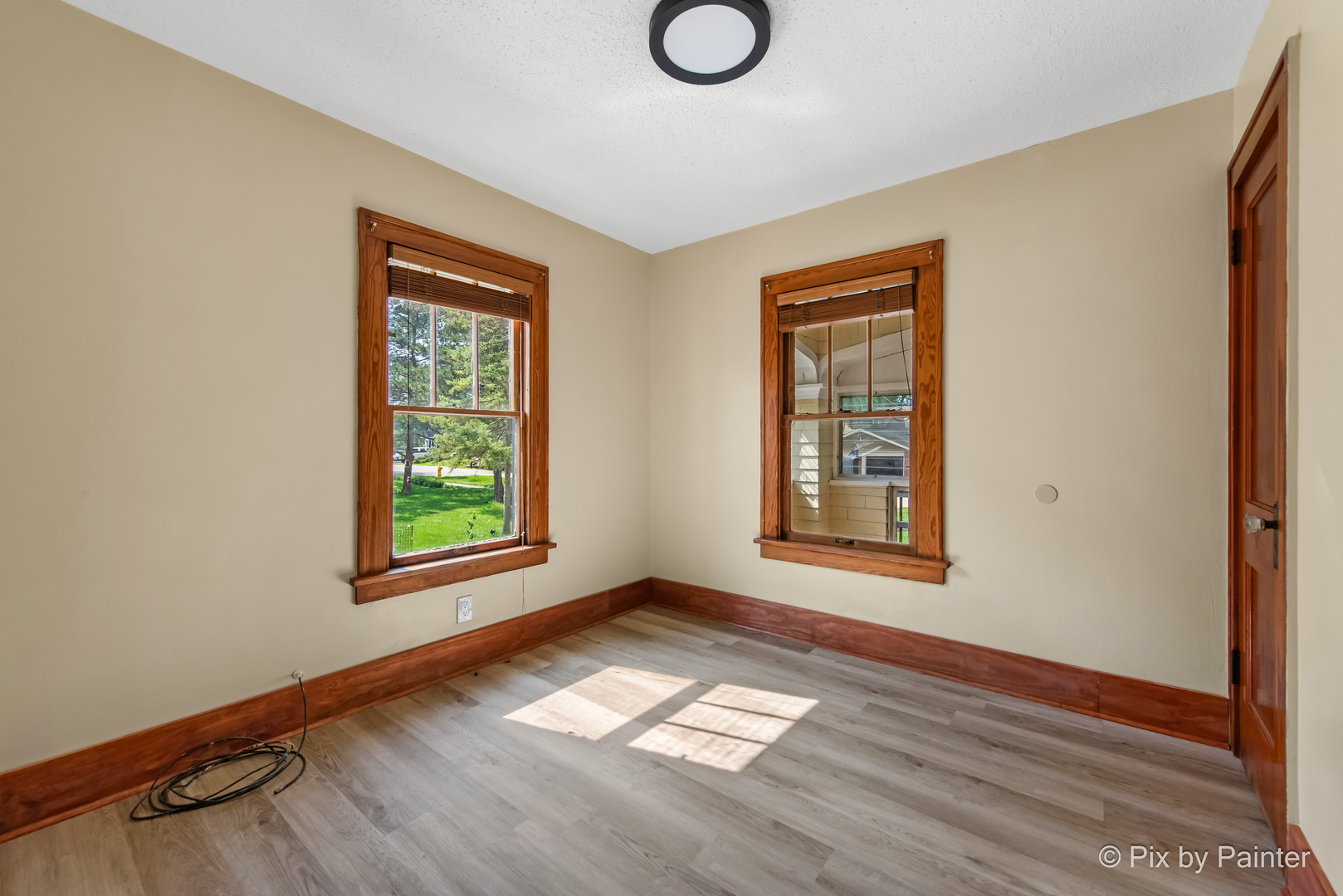 503 North River Road Fox River Grove, IL 60021 - Photo 11 of 48 a view of an empty room with wooden floor and a window