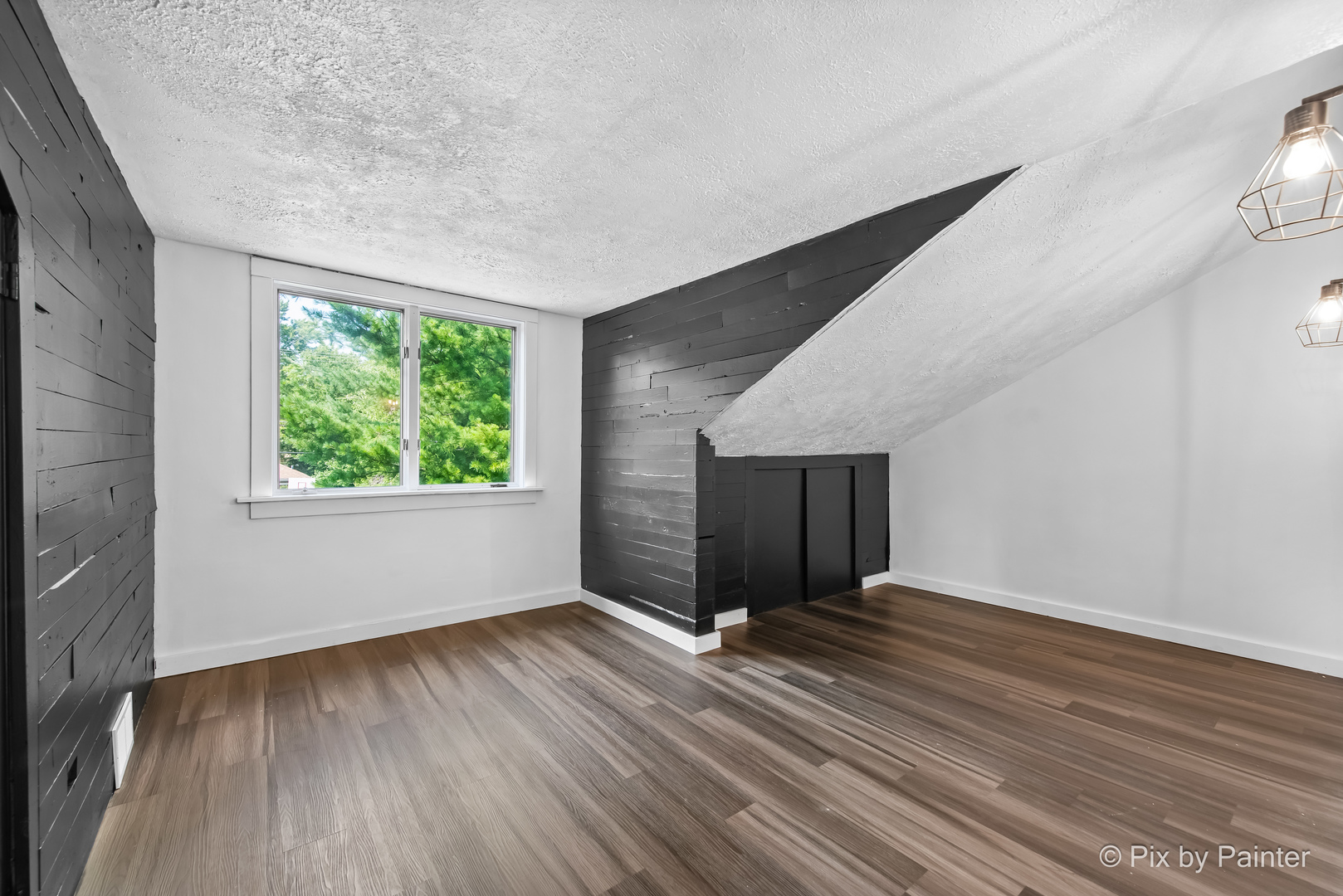 503 North River Road Fox River Grove, IL 60021 - Photo 17 of 48 a view of an empty room with wooden floor and a window