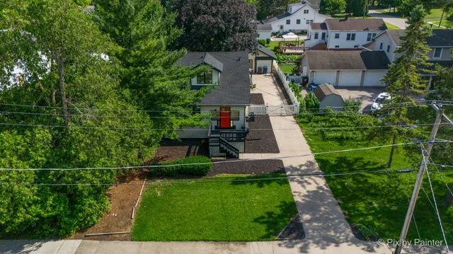 an aerial view of a house with a garden