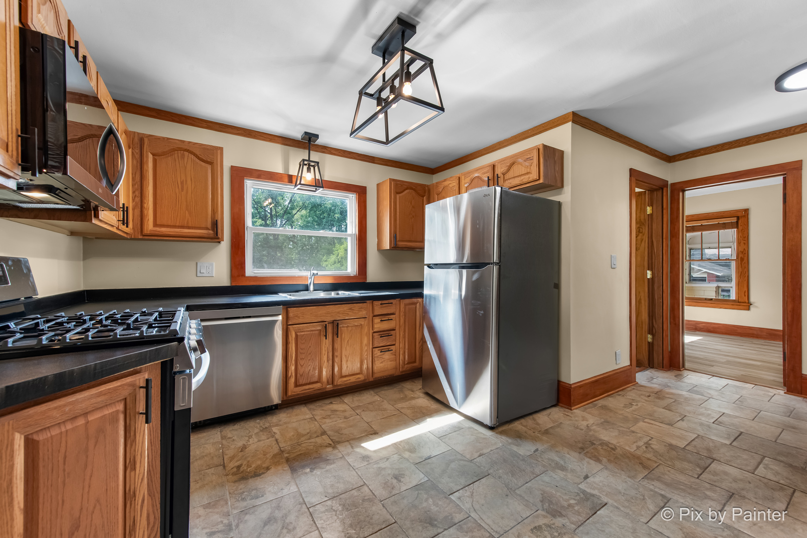 503 North River Road Fox River Grove, IL 60021 - Photo 7 of 48 a kitchen with stainless steel appliances granite countertop a refrigerator a stove a sink and a microwave