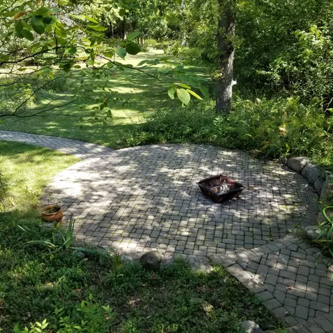 a backyard of a house with lots of green space
