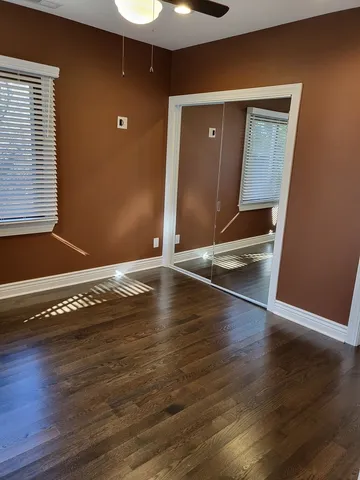 a view of room with wooden floor
