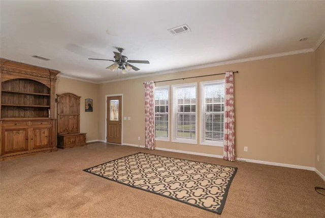 a view of livingroom with workspace and window