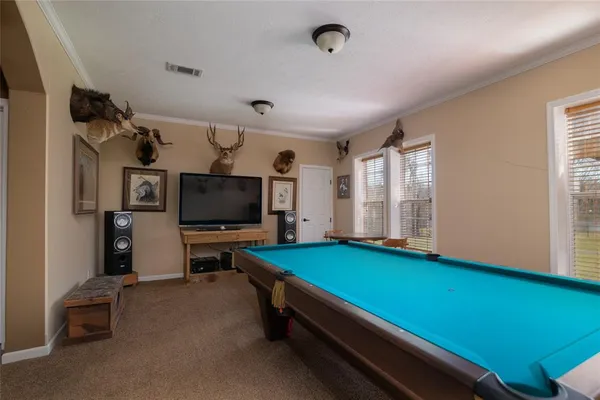 a room with furniture and a flat screen tv