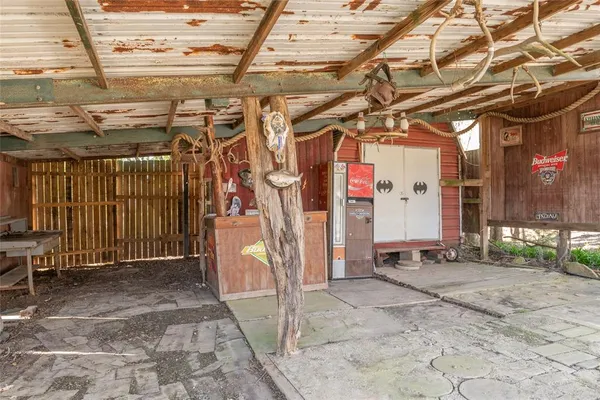 a view of a garage with wooden fence