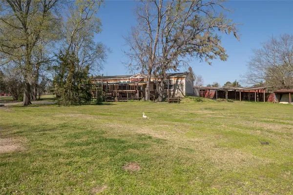 a view of a house with a big yard