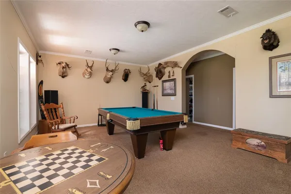 a room with lots of furniture and air conditioner